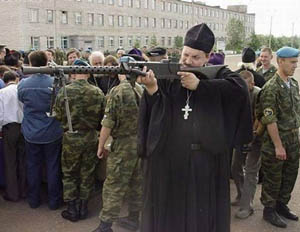 [Image: priest-with-gun.jpg]