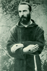 Padre Pio, a well known fraudulent stigmatic, with his nail holes in the wrong place