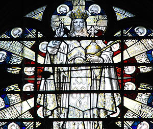 God in the white robes of a pre-Christian priest, with the trappings of a medieval European king: crown, orb and scepter God