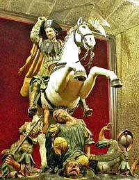 Saint James the Moor Slayer, depicted here (in the cathedral of Santiago de Compostel), won his title by appearing during the crusades and killing people - some trampled underfoot, some hacked to pieces.